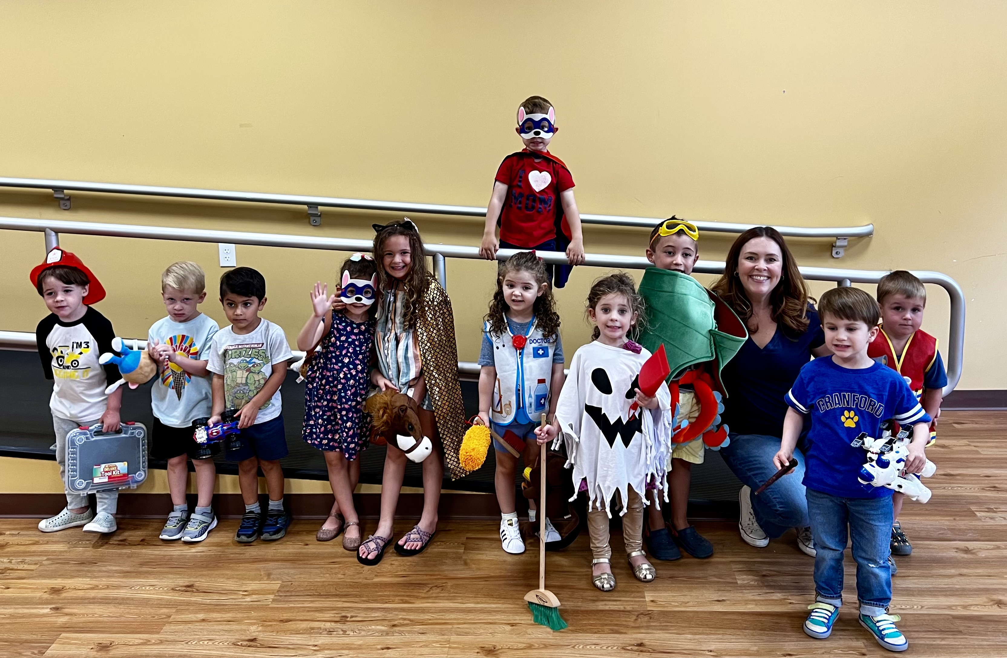 Children lined up in Halloween costumes